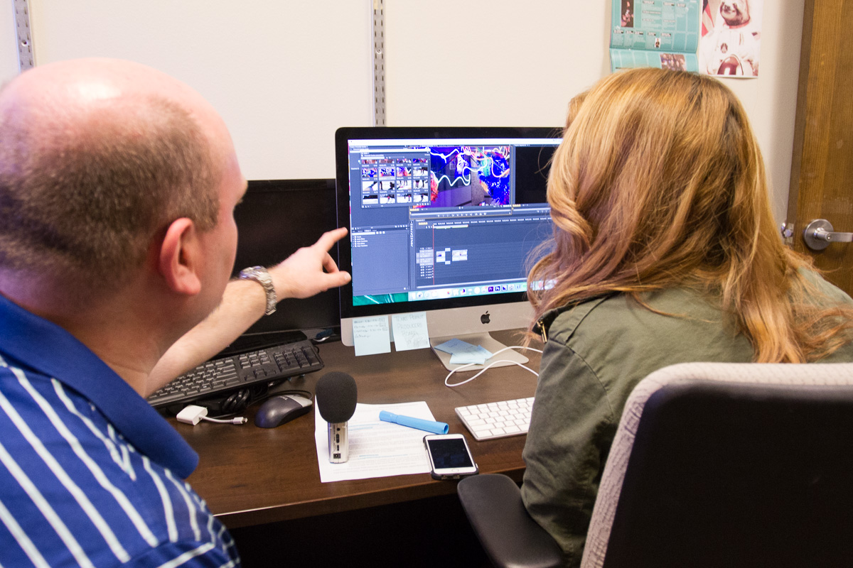Josh and Laura editing an MCTV episode
