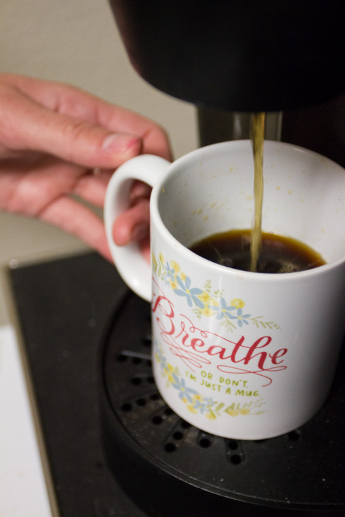 Coffee getting poured into a coffee mug