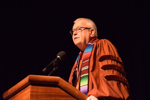 Dean Ridley speaking at graduate hooding ceremony