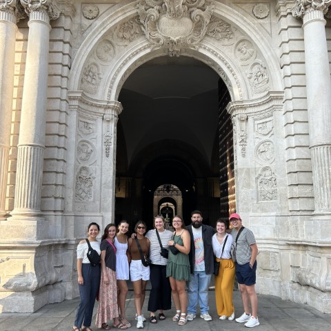 Students in front of an arch in Sevilla, Spain