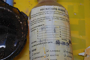 One of two 500 ml bottles of nitric acid that were broken.