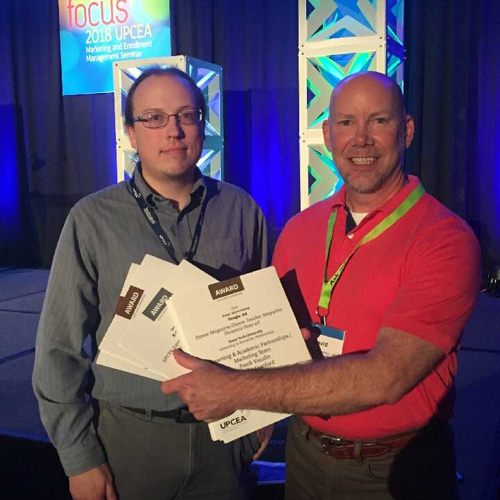 Frank Vaculin, graphic designer (left), and David Hankins, senior marketing director, for Texas Tech's eLearning & Academic Partnerships, show off more than a dozen marketing awards from the 2018 UPCEA Marketing and Enrollment Management Seminar. 
