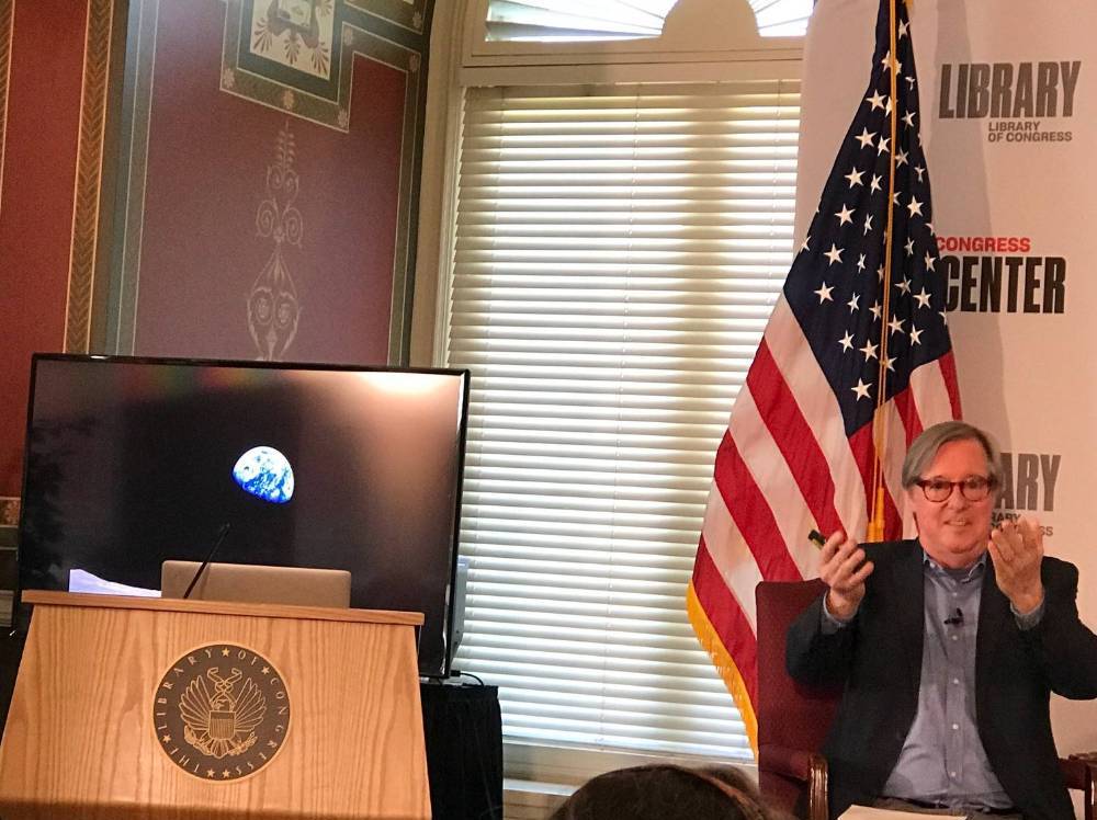 Dr. Bruce Clarke leading a public event he directed in April 2019 at the Library of Congress to celebrate the 50th anniversary of the Earthrise photograph.