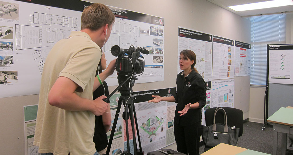 Interior and Environmental Design graduate students being interviewed by media during final presentation of sustainable design project Interior and Environmental Design graduate students being interviewed by media during final presentation of sustainable design project