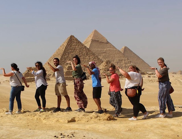 students in front of pyramids