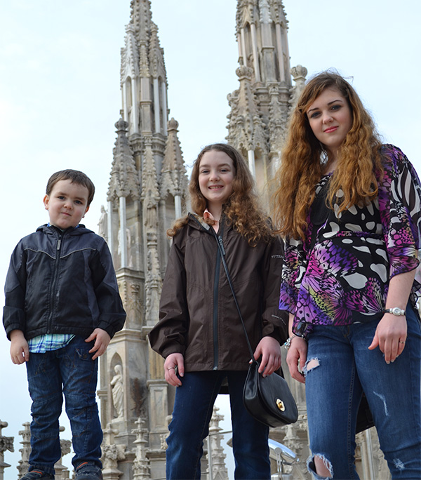 Jacob, Katie, and Jentry Williams in front of Duomo di Milano in Milan, Italy.