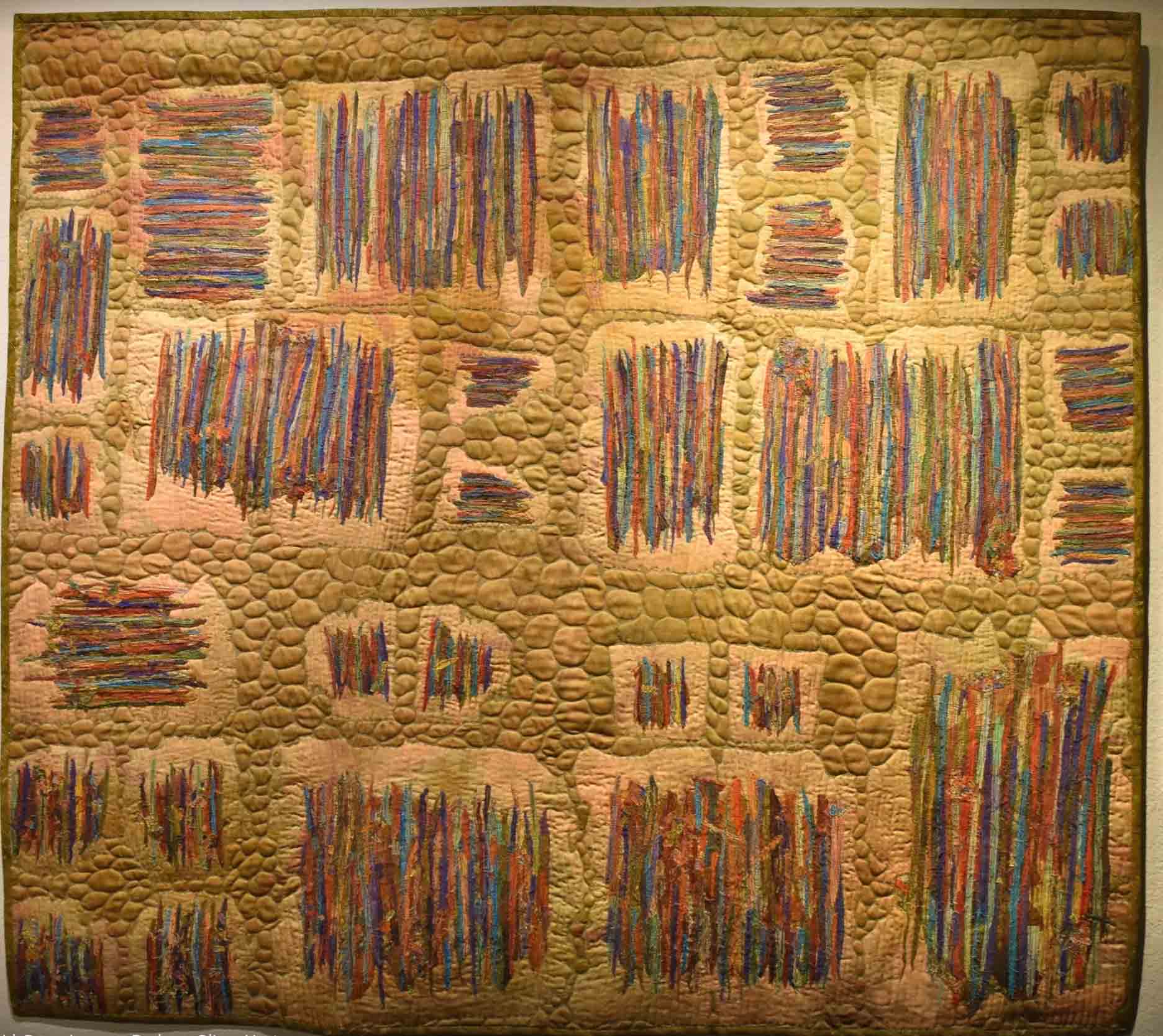 art quilt of blocks thread painted in rows
