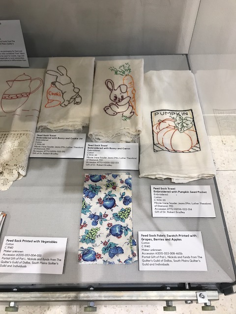 Towels made from feed sacks embroidered with bunnies and a seed packet. 