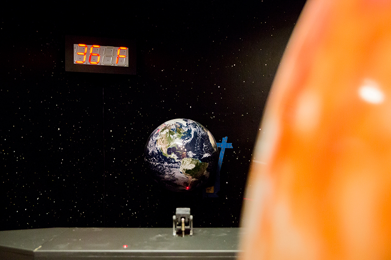 weather exhibit - globe with laser and thermometer to show earth's temperature