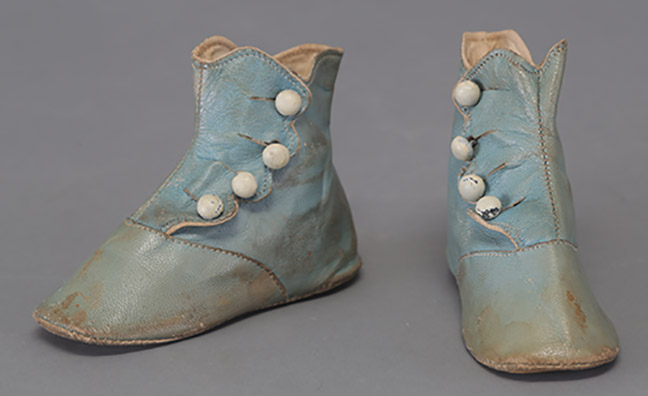 Child’s Blue Leather High Top Flat Shoes with Four White Buttons Along Side, c 1880s, Gift of L. Jean and Rebecca Wallace, TTU-H2017-030-         088