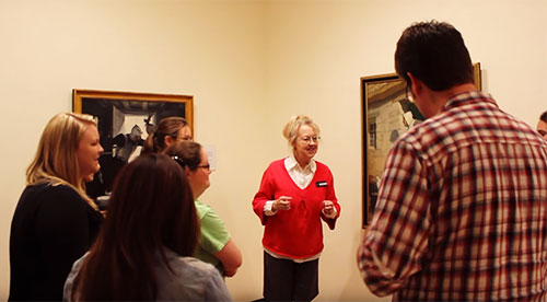 docent speaking to group during tour