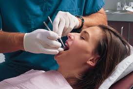 Dentist treating patient