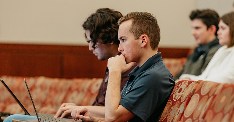 Two Students with Laptop in Class