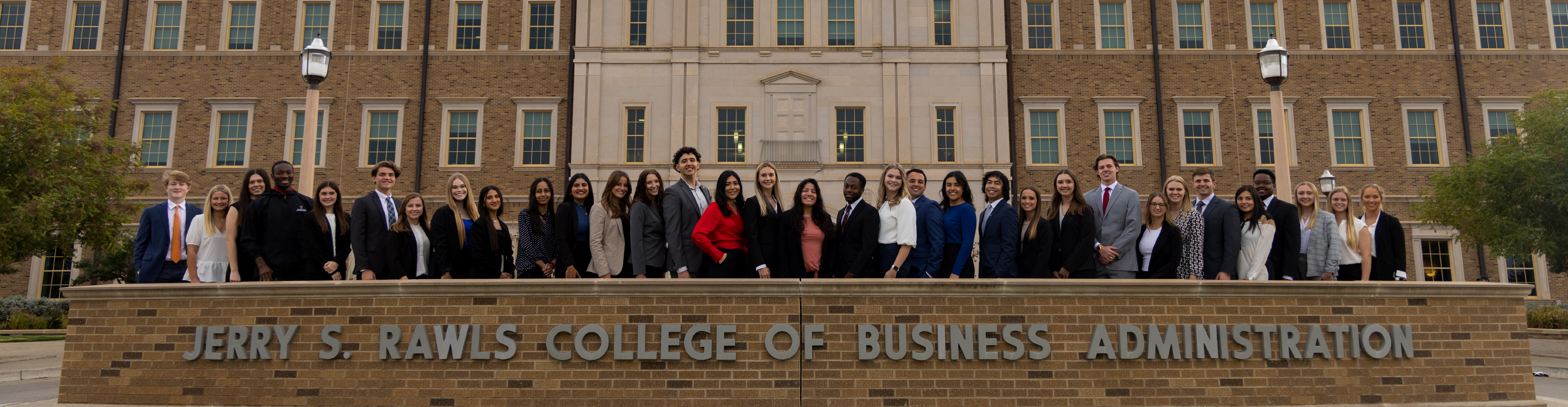 Photo of ambassadors in front of Rawls College building