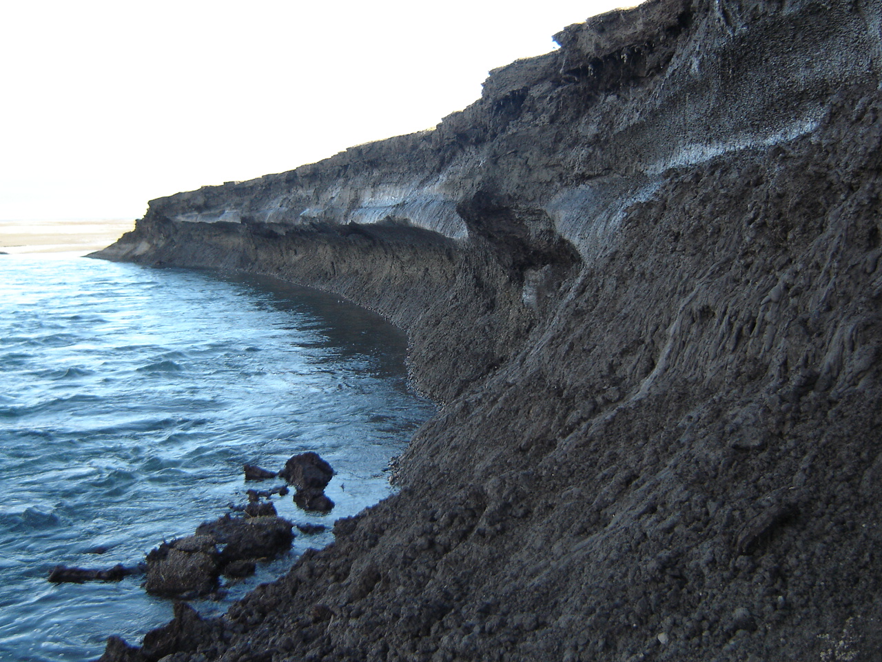 jagged cliffside near ocean