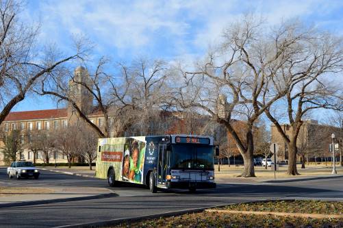 Bus makes a turn on Tech campus on Memorial Circle.