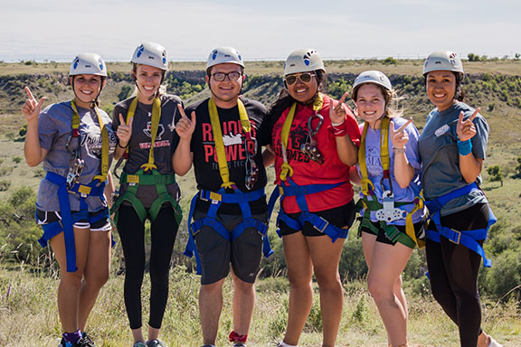 Group in safety gear at the zipline