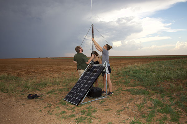 bruning setting up equipment with grad students