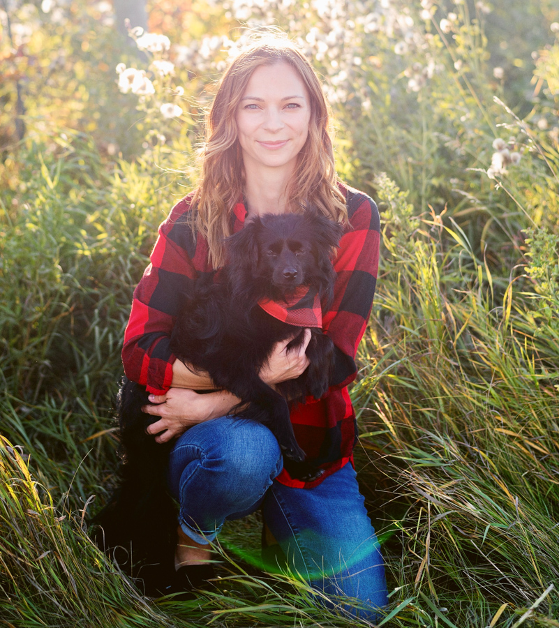 Woman with black dog.