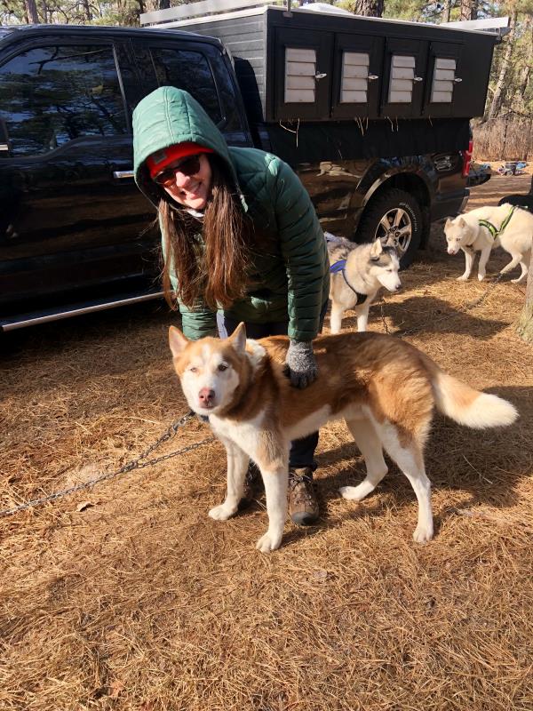 Glenna holding a dog