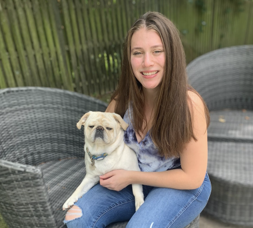 Liza Rothkoff posing with dog