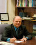 Dr. Norman Hopper at desk