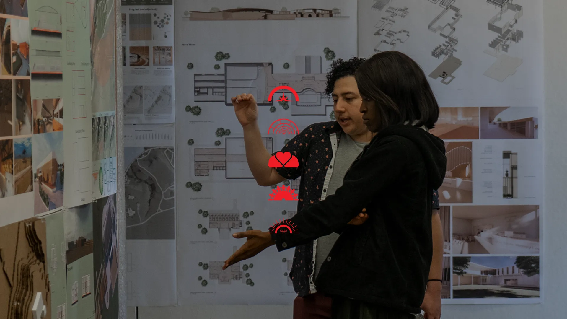 Students collaborating and talking about pin-up work. 