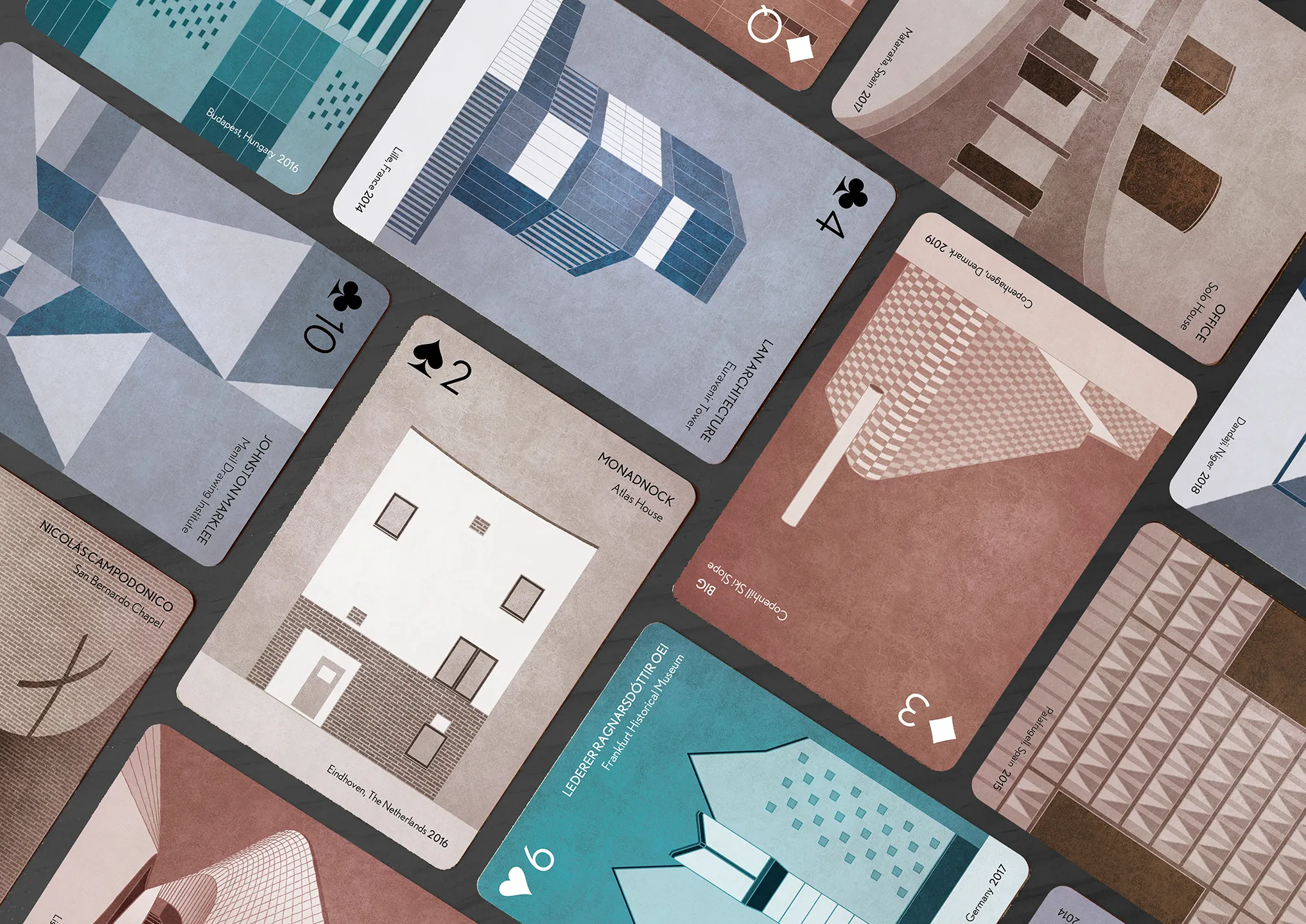A set of playing cards arranged in a herringbone grid pattern, with different architecture projects on the faces of the cards