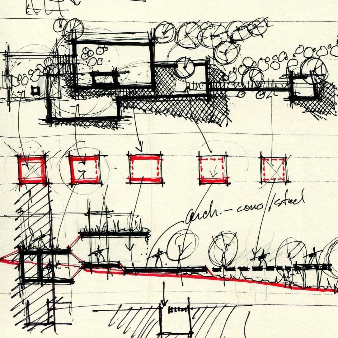 A hand drawn sketch in black and red ink depicting a draft of a floor plan.