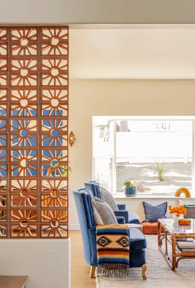 A photo of an interior with blue and orange accenting furniture
