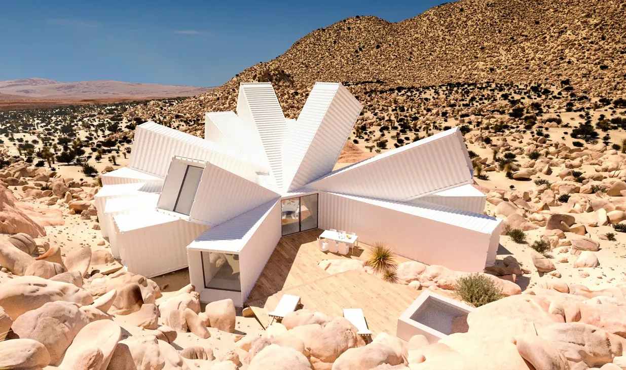 Four white shipping containers seated in the desert, with the text CLOUD HUNTING written in read at the bottom of the image.