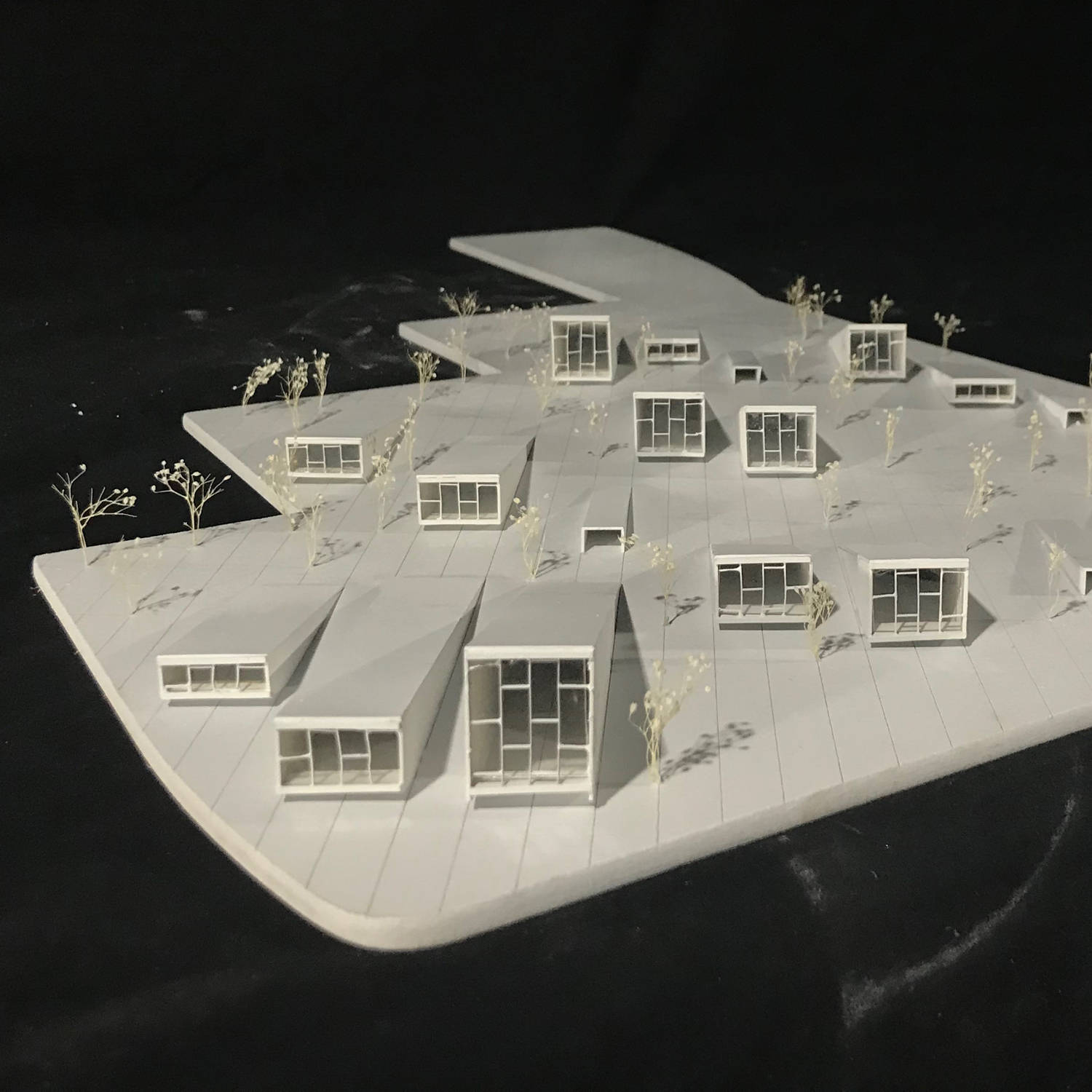 Paper models on a floating foam core island.