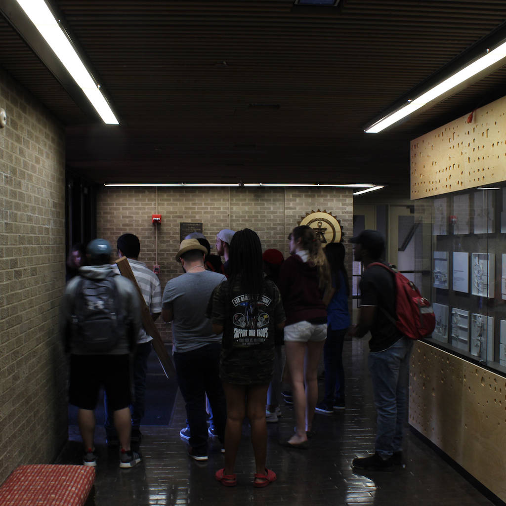 Students gathering in the College of Architecture hallway.