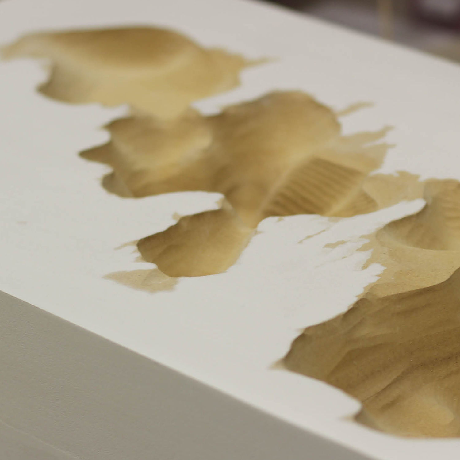 Abstract watercolor with a shape made in the negative space.