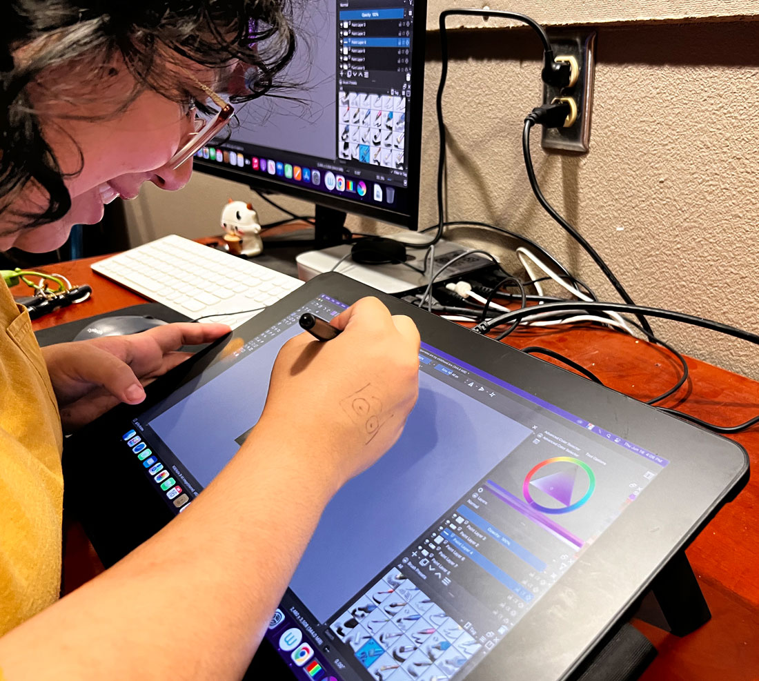 Student drawing on an iPad