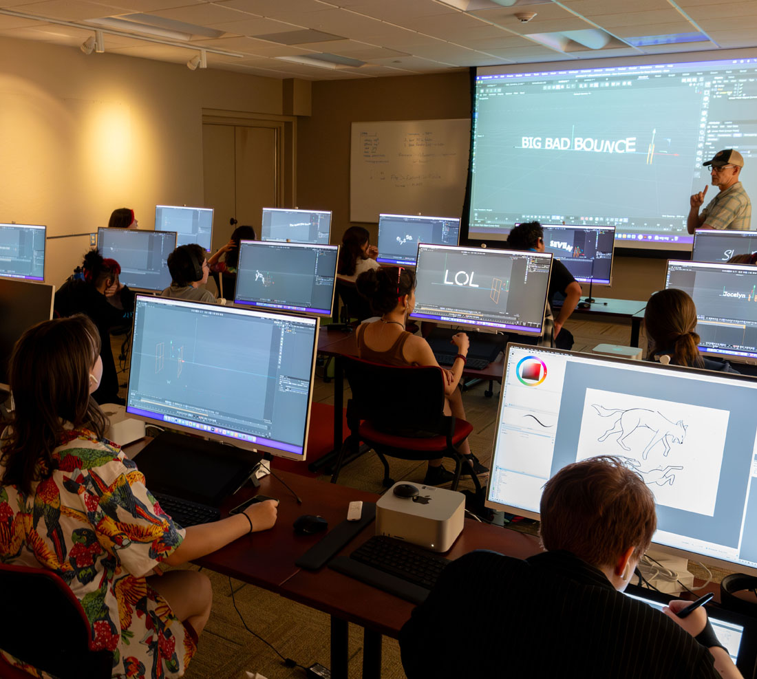 TTU Summer camp students sitting at a computer