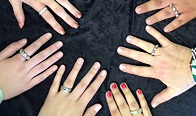 SMAP students displaying their cast silver rings.