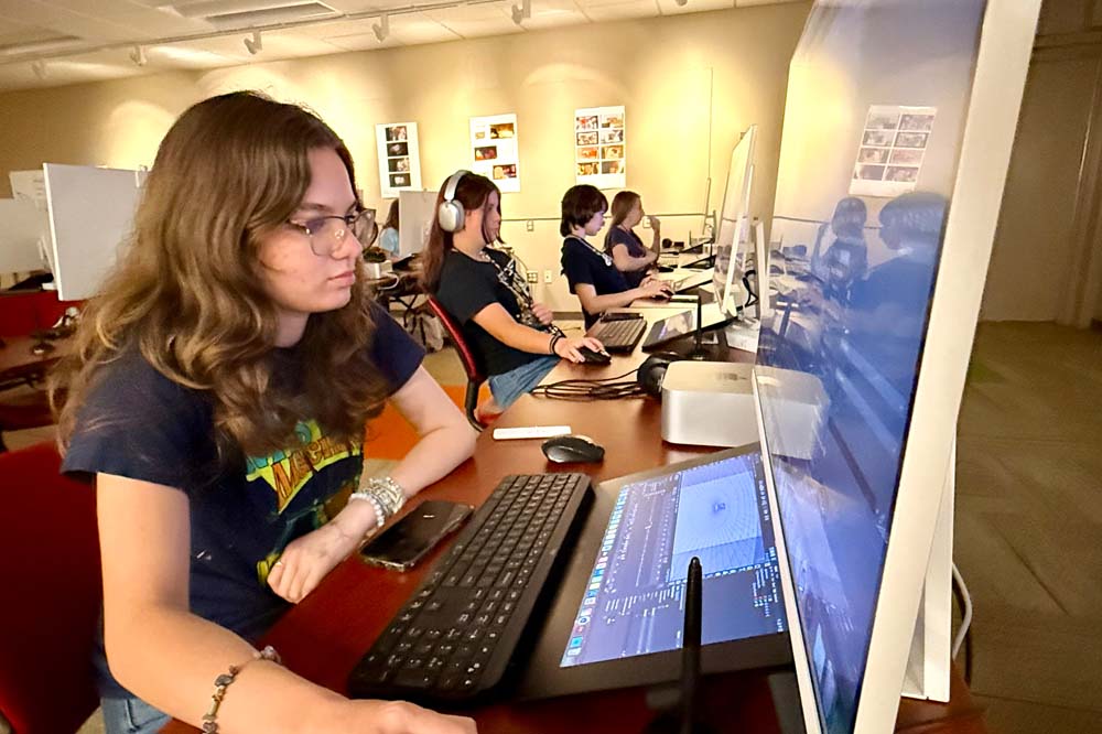 School of Art Summer Program for High School Students with camp goer using a computer