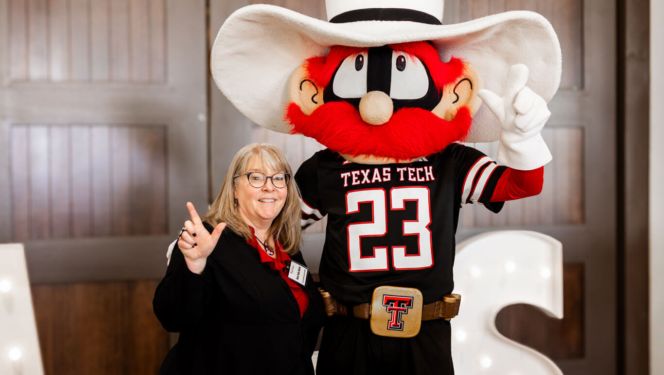 college of arts and science dean tosha dupras with texas tech mascot raider red