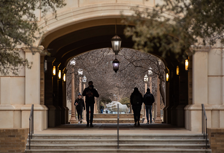 Texas Tech university students walking though a hall outside of admin building