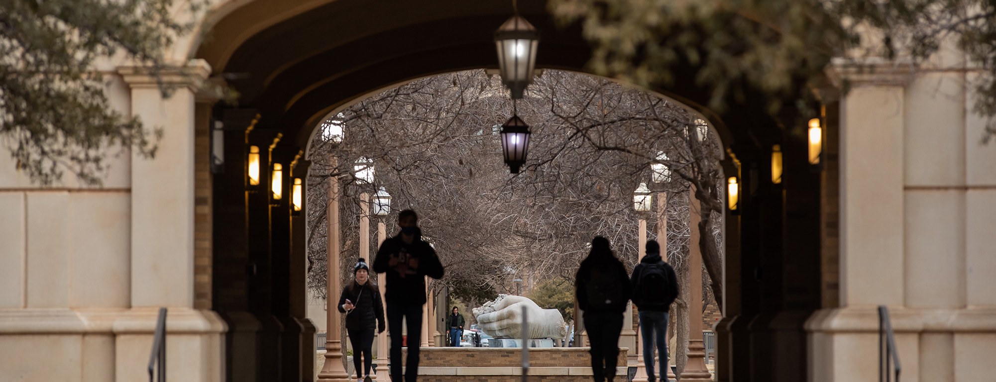 Texas Tech students walking through a tunnel at admin building