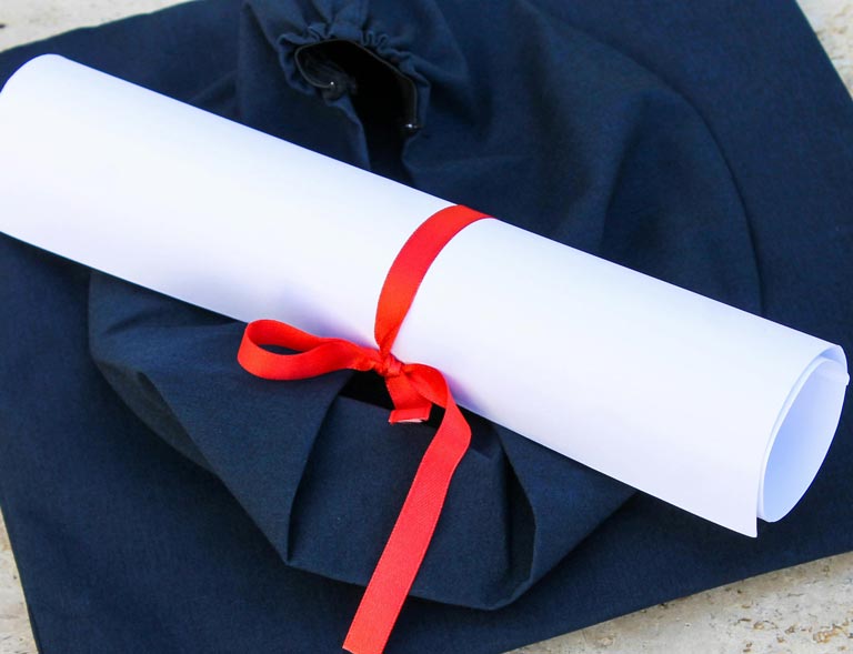 black graduation cap in certification/degree on to