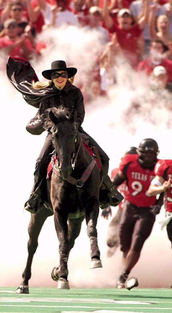 Masked Rider entering the football field