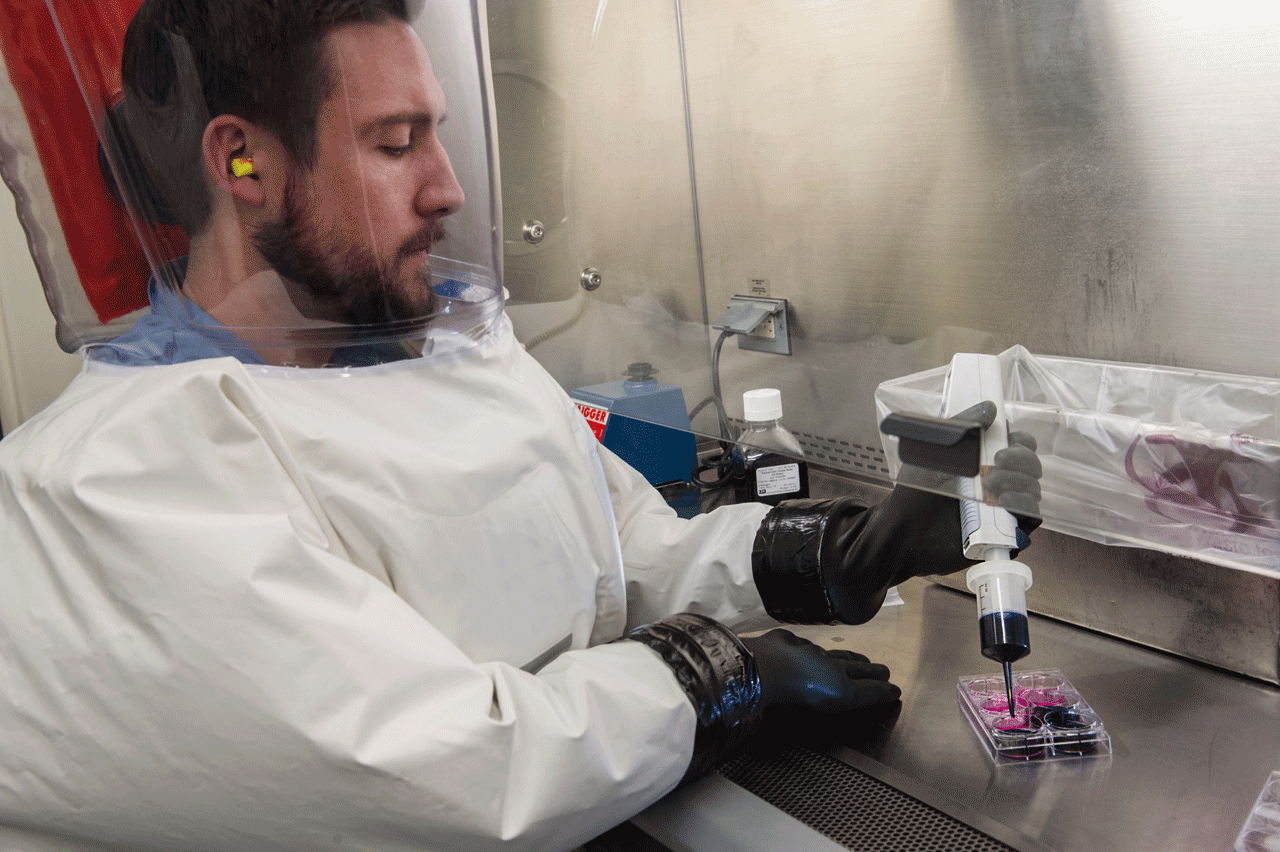 CDC microbiologist and TTU alumnus Matt Mauldin in a BSL-4 lab. photo courtesy CDC