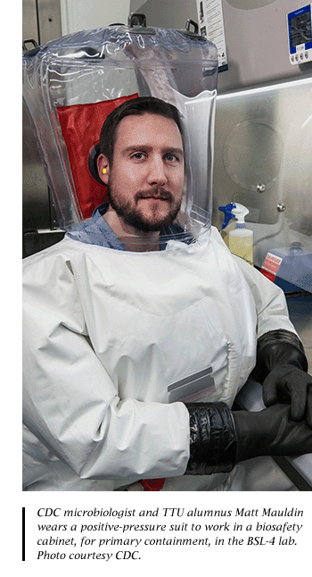 CDC microbiologist and TTU alumnus Matt Mauldin in a positive-pressure suit in a Level 4 lab