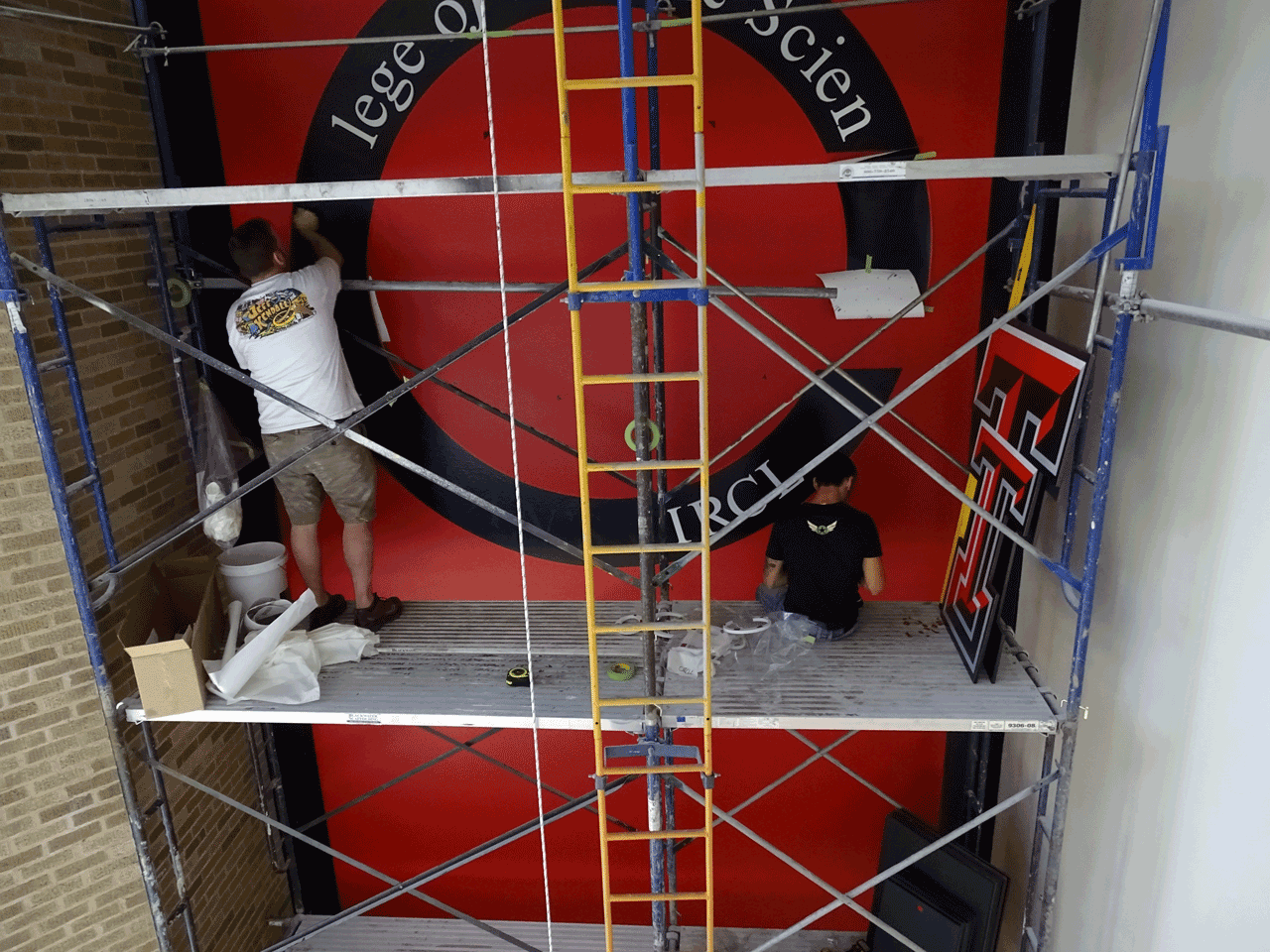 TTU Holden Hall Atrium Mural double T Install; photo by Toni Salama