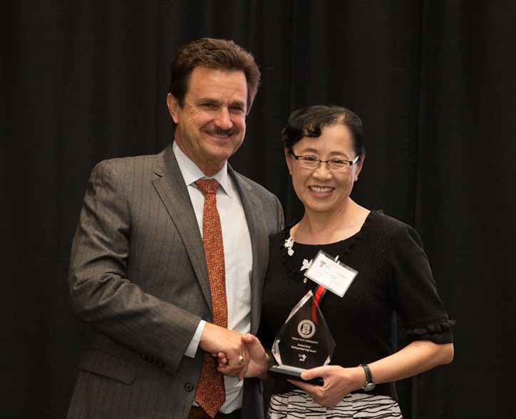 TTU President Lawrence Schovanec and Arts & Sciences Budget Director Li Qin
