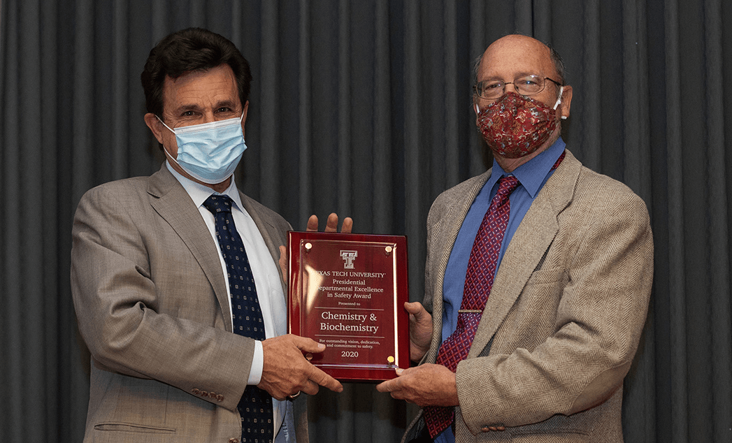 TTU president Lawrence Schovanec, left, with TTU chemist Dominick Casadonte, right