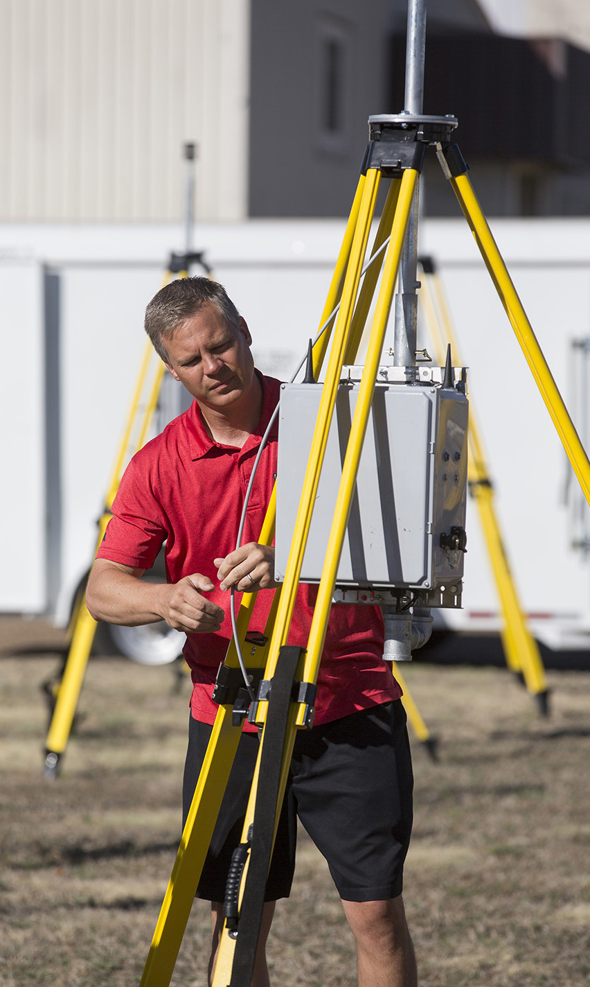 John Schroeder, TTU atmospheric scientist, tests a StickNet