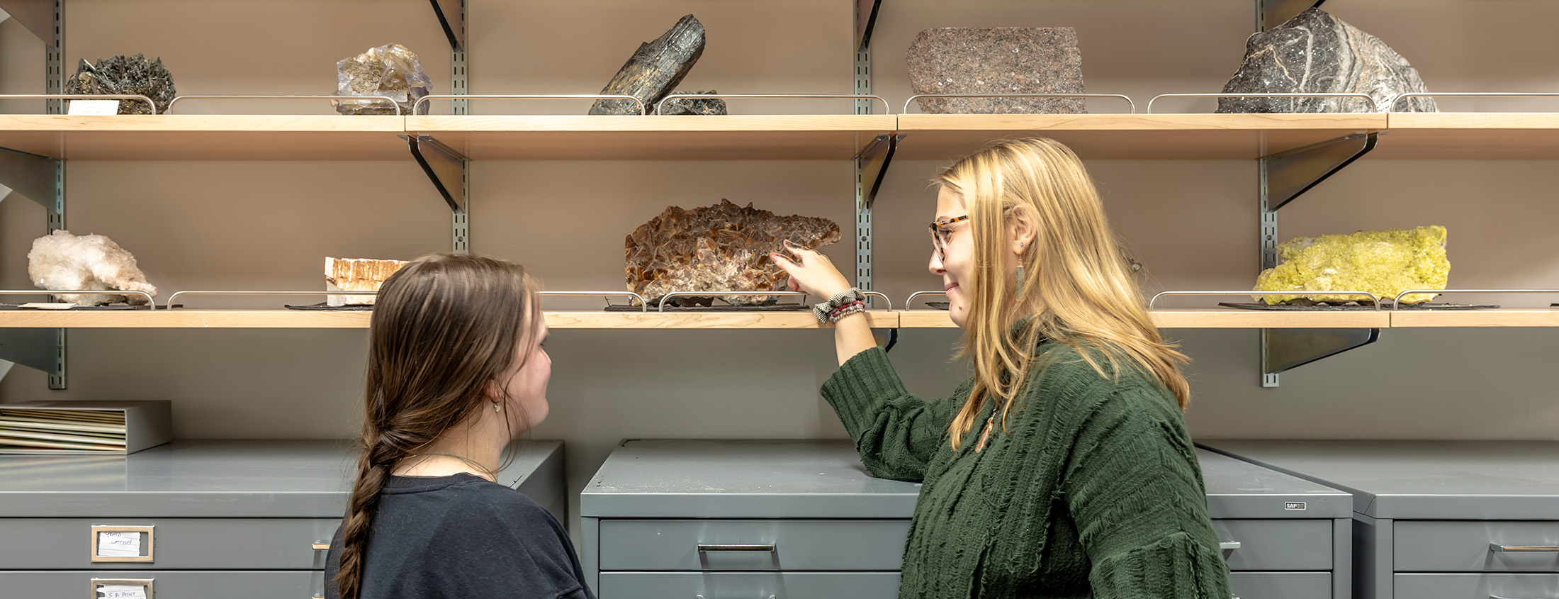 arts and science students examining geodes
